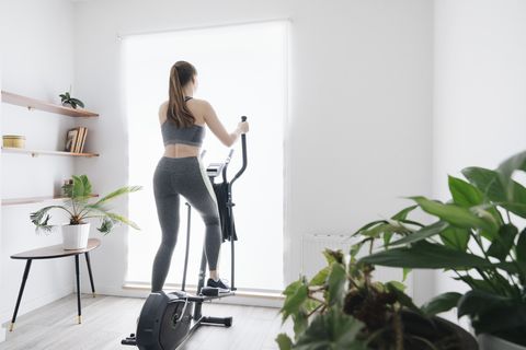 woman-performing-workout-on-elliptical-trainer-at-royalty-free-image-1651049228.jpg